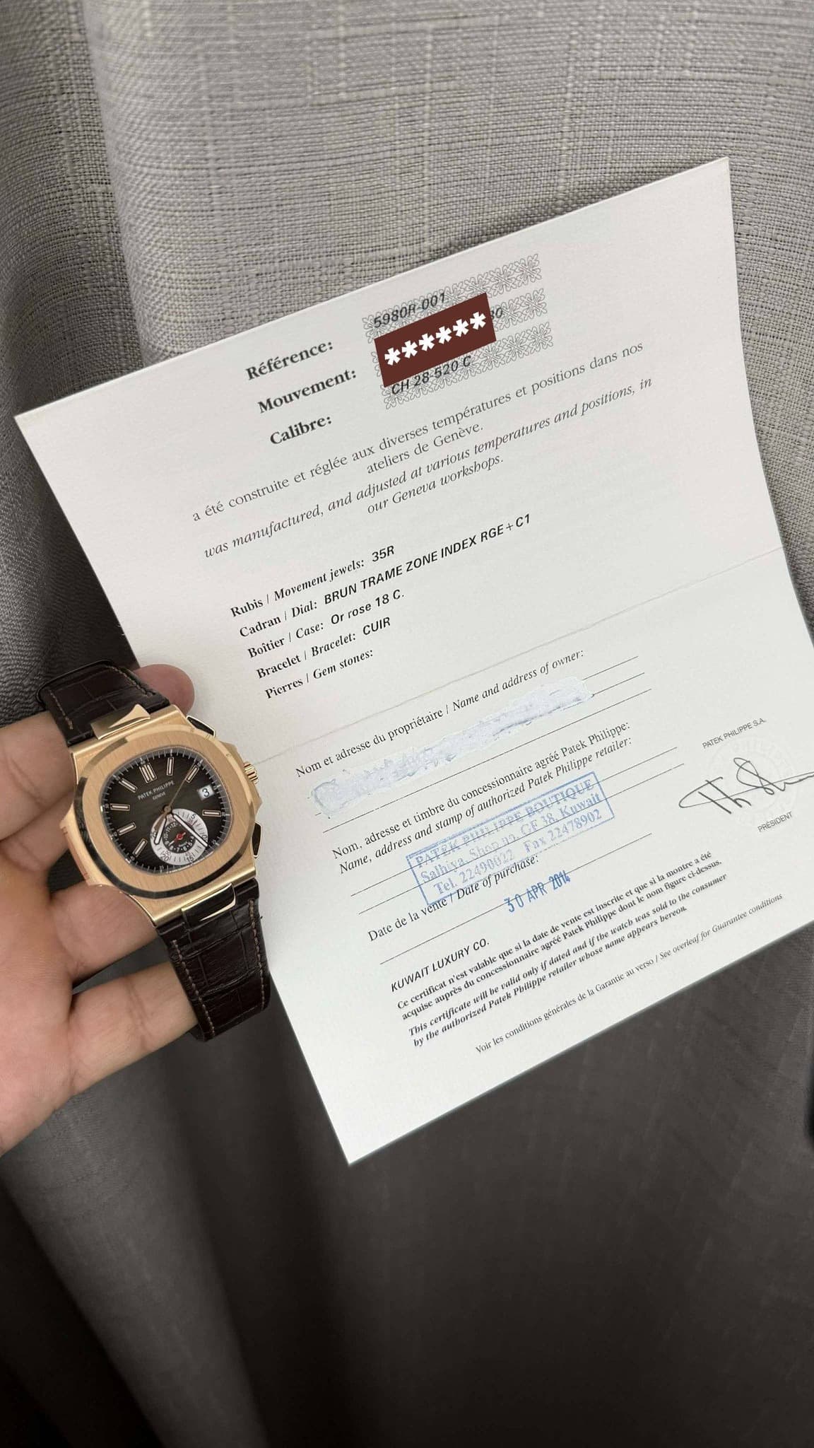 May be an image of digital watch, ticket stub and text