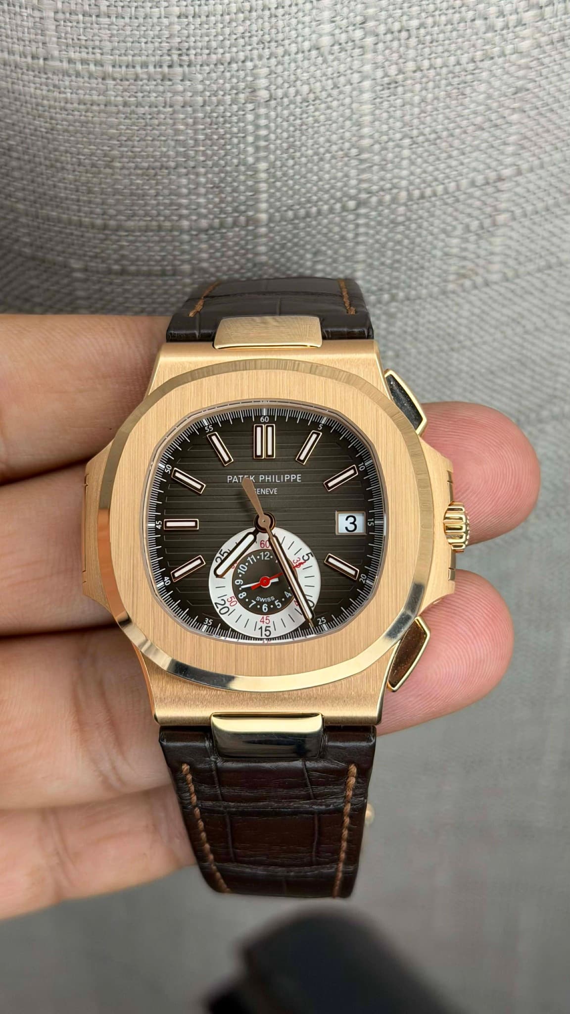 May be an image of wrist watch and text