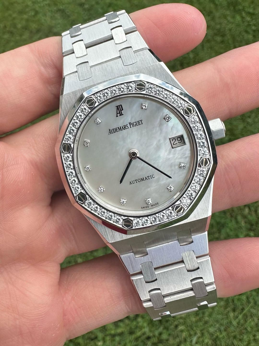 May be an image of wrist watch and text