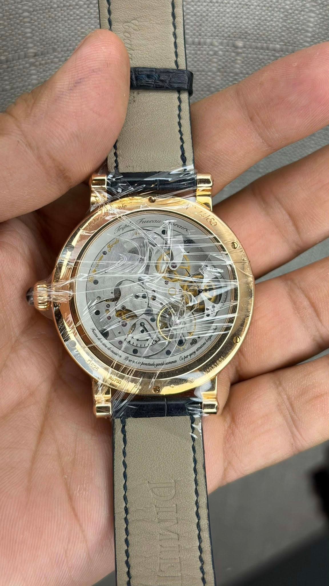 May be an image of wrist watch and text