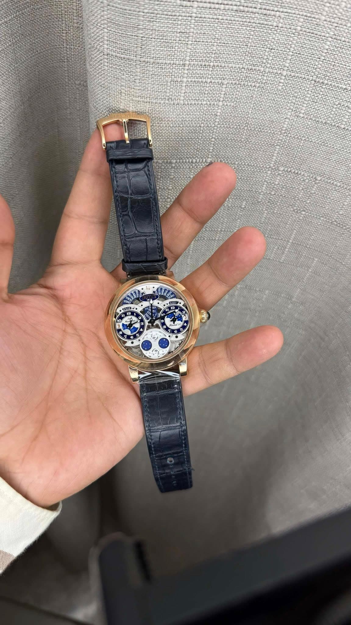 May be an image of wrist watch and text