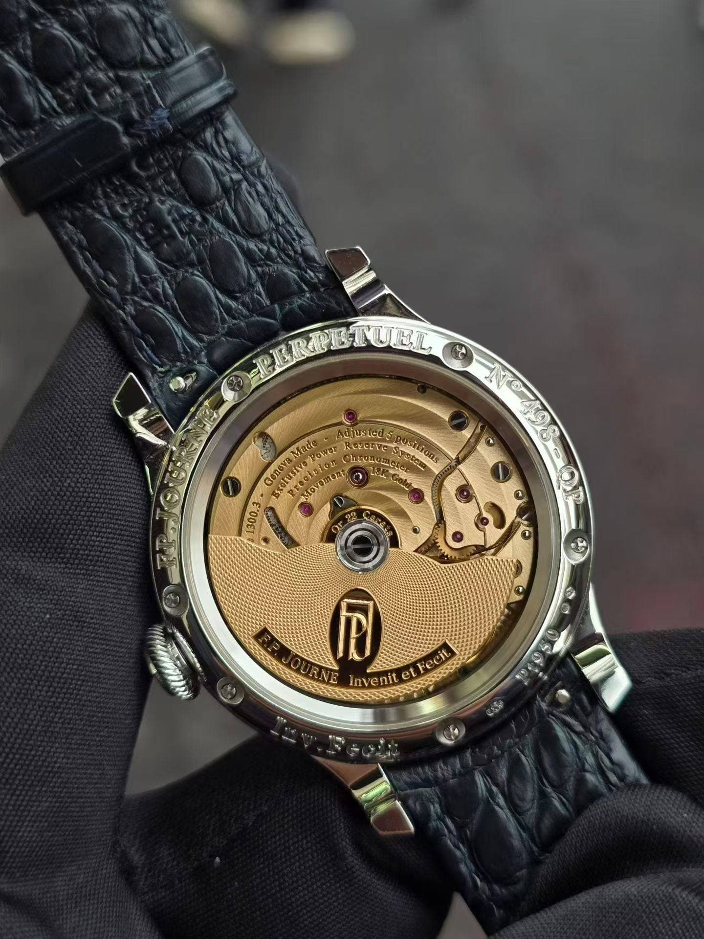 May be an image of wrist watch and text
