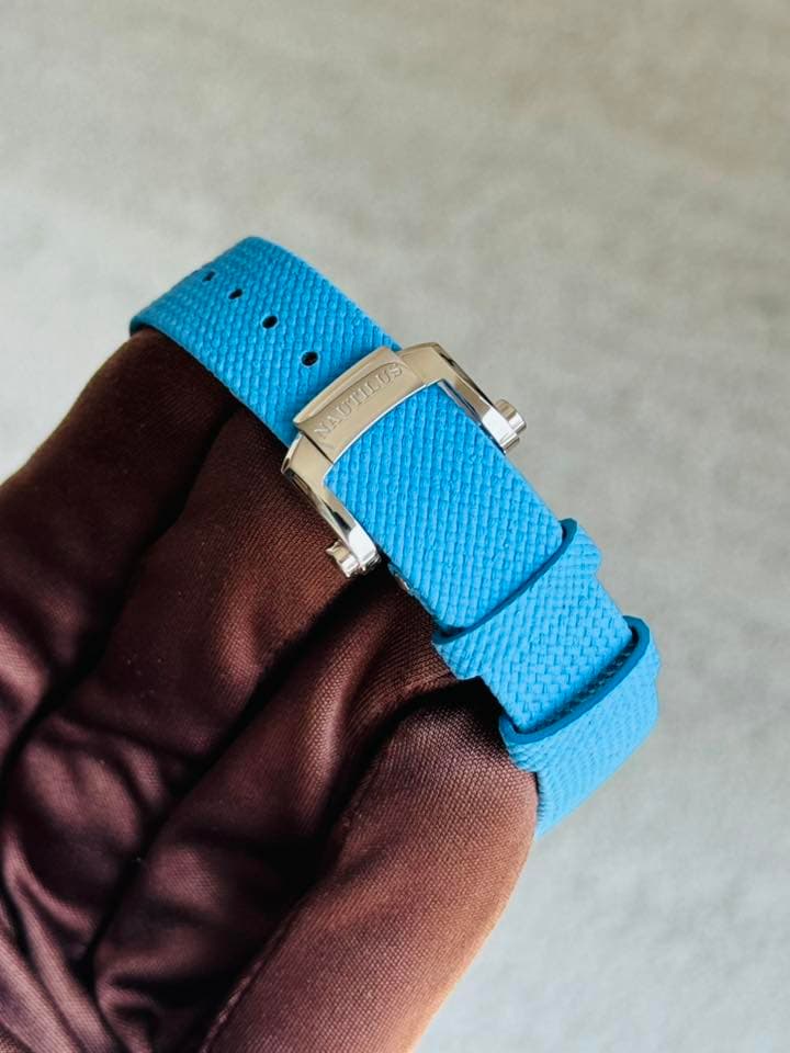 May be an image of saddle-stitched leather and wrist watch