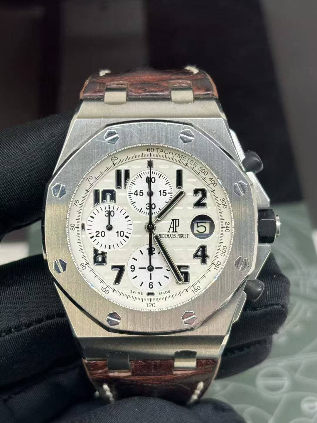 May be an image of wrist watch and text