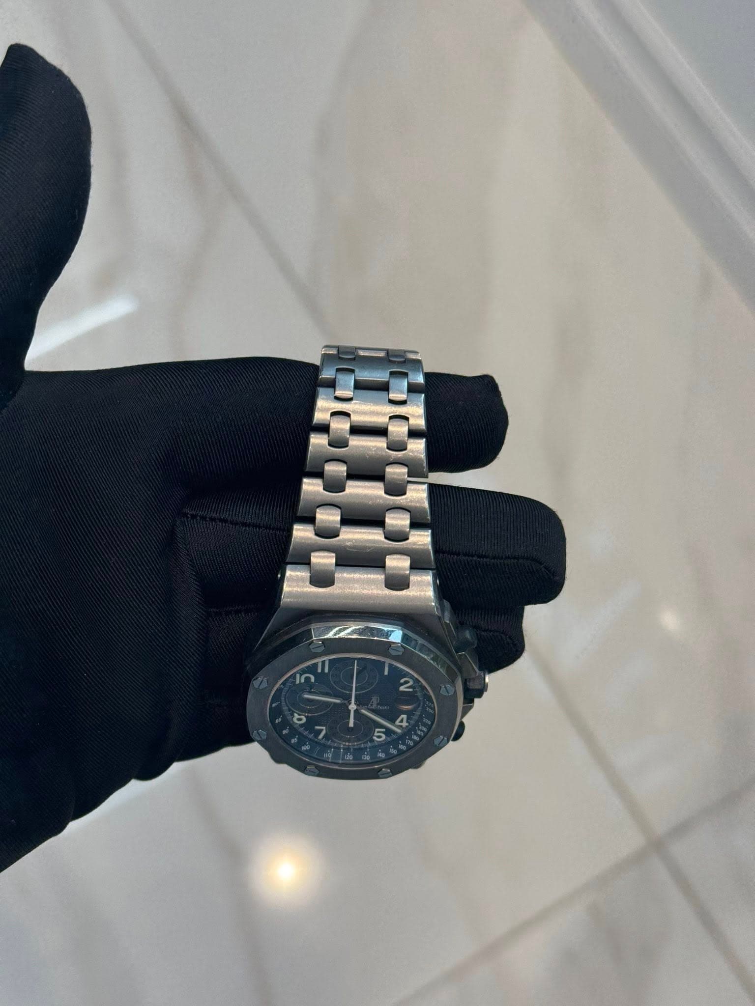 May be an image of wrist watch and text