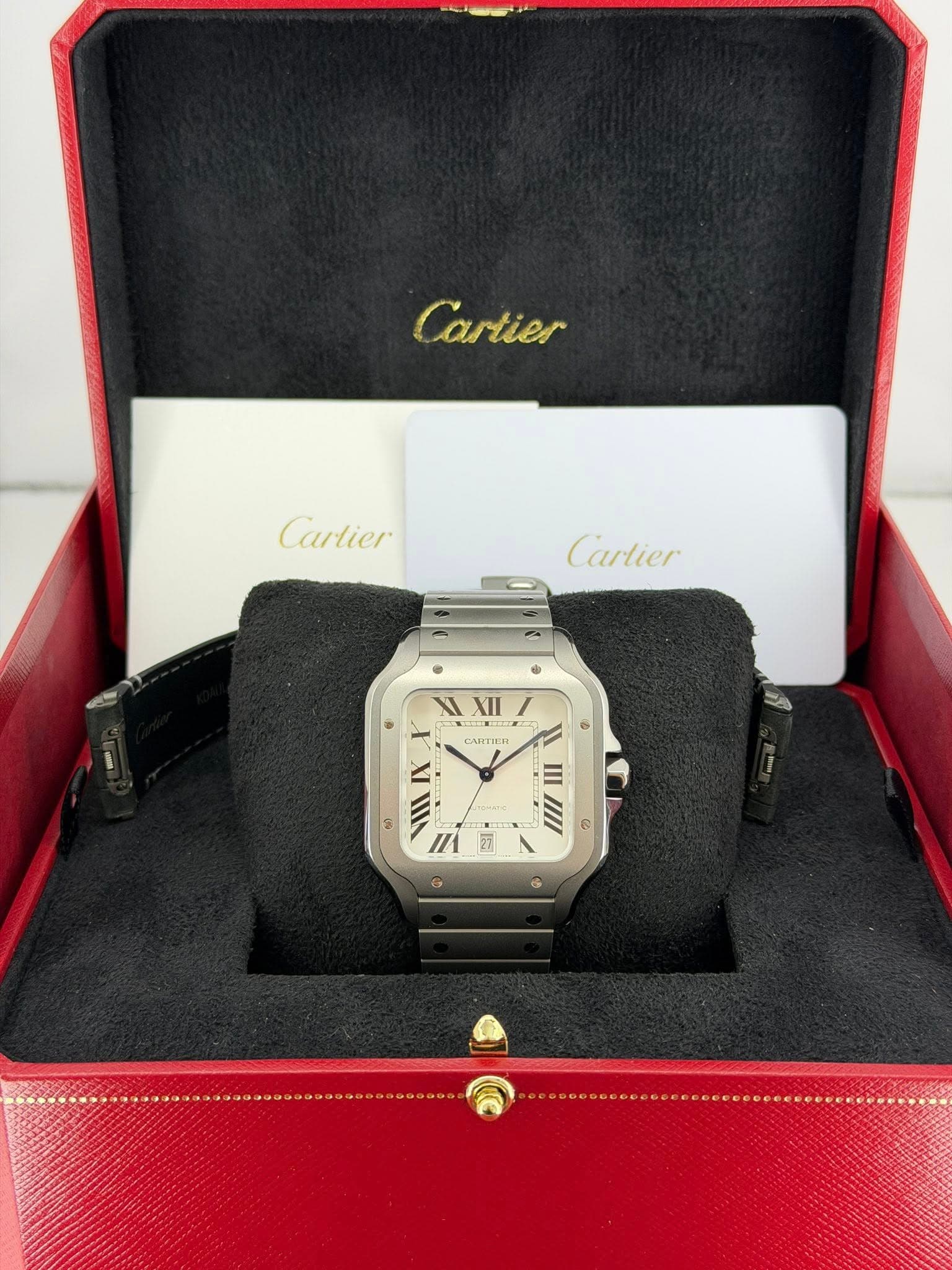 May be an image of digital watch and text that says 'mAC الاا ឆ្ា gt Cartier Cartier Cartier - 2 ® i X XII XII CANTICR 湯 මඩා IX ក្កា VIII ET I الووم 25 = uII 公 ®'