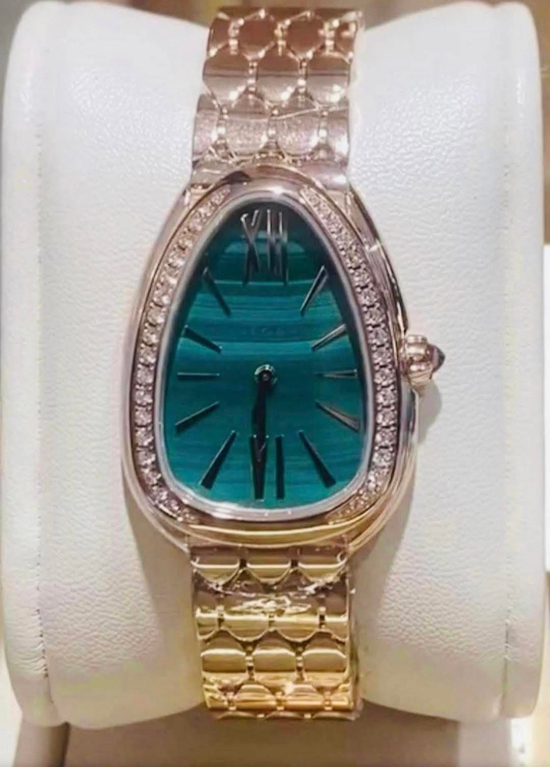 May be an image of wrist watch and jewelry