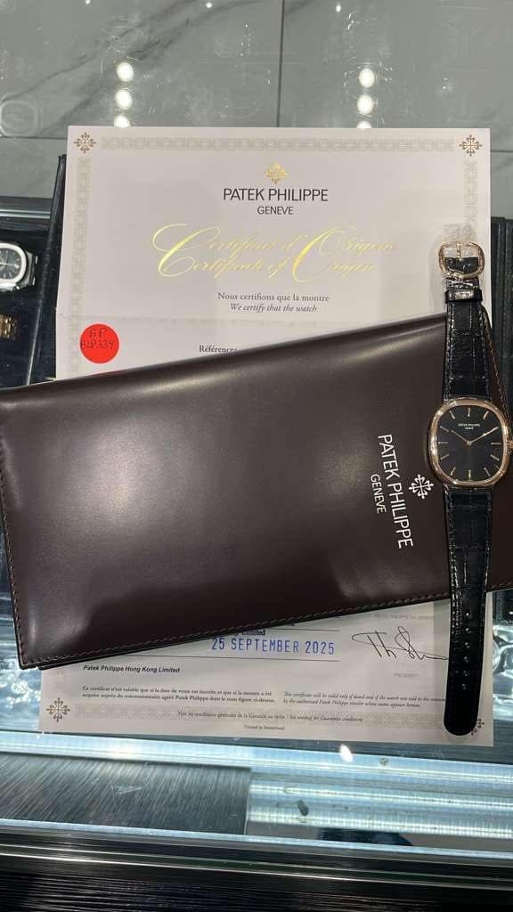 May be an image of wrist watch, leather and text