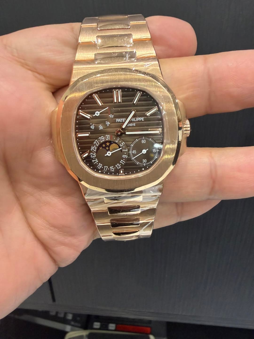 May be an image of wrist watch and text