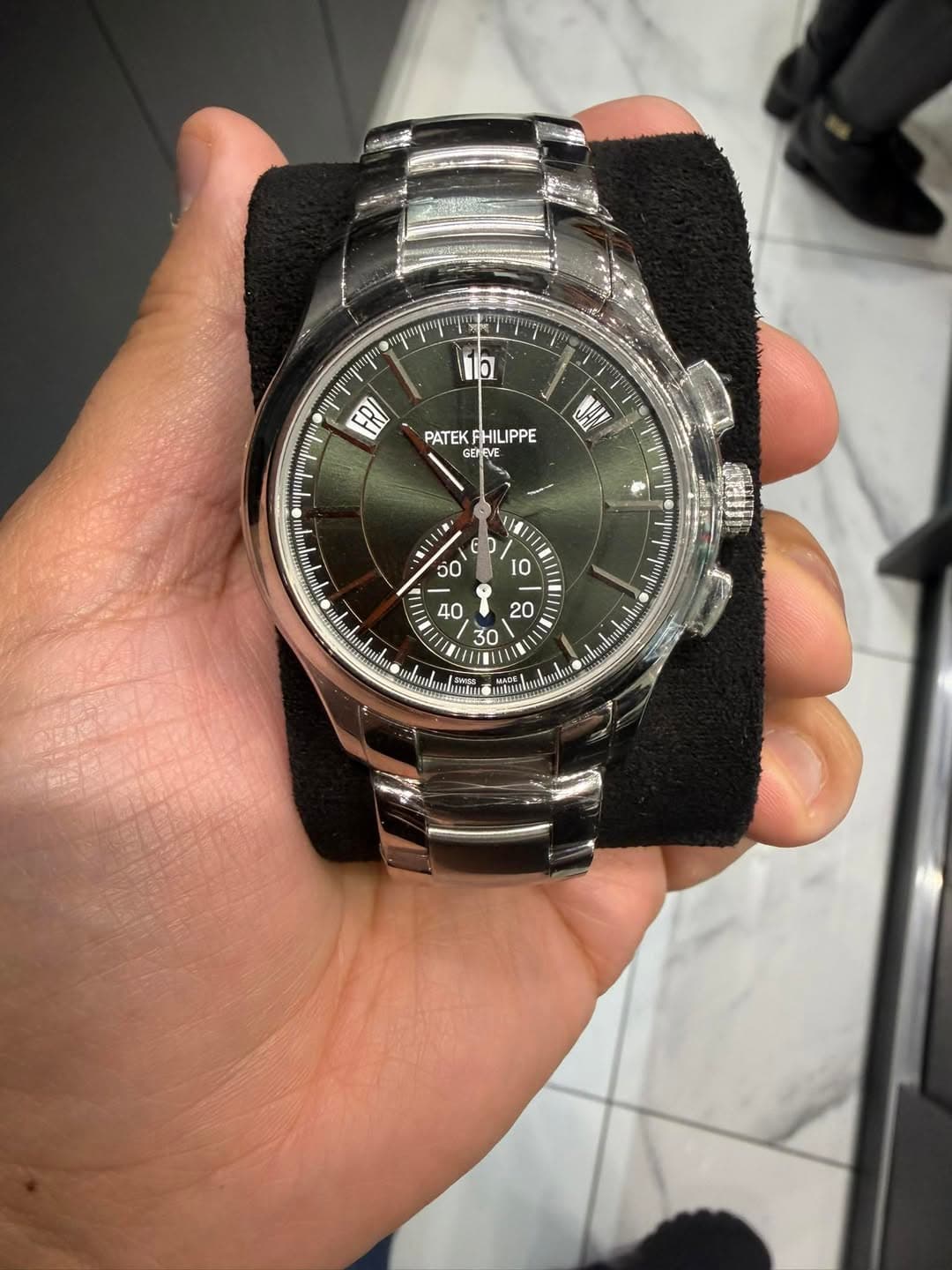 May be an image of wrist watch and text