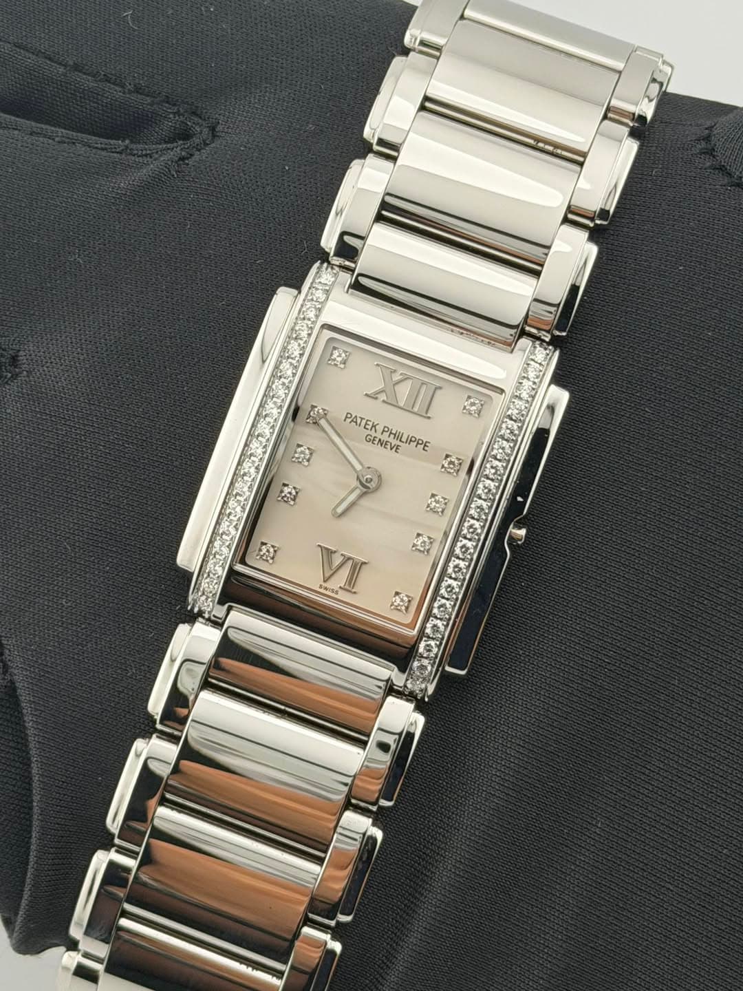 May be an image of jewelry, digital watch and text