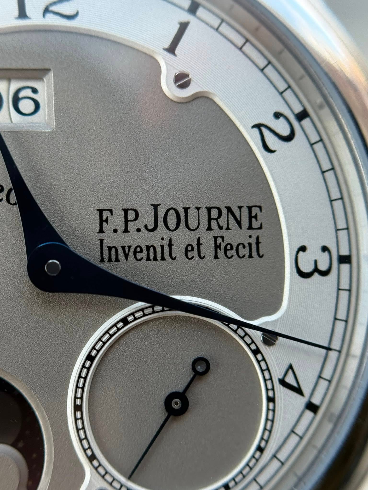 May be an image of wrist watch and text that says '6 N F.P.JOURNE Invenit InvenitetFecit et Fecit ωω --55 ح ----'