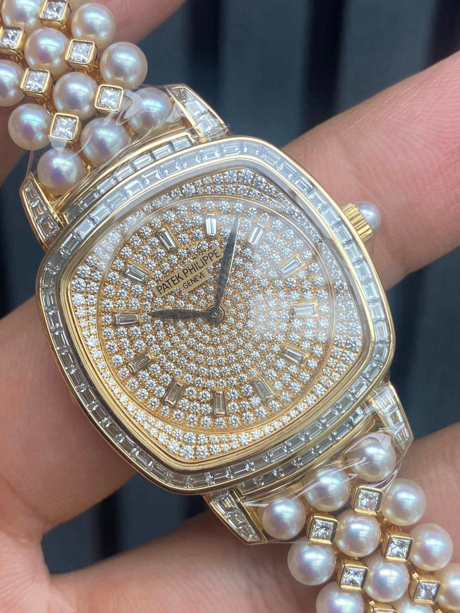 May be an image of jewelry, wrist watch and text