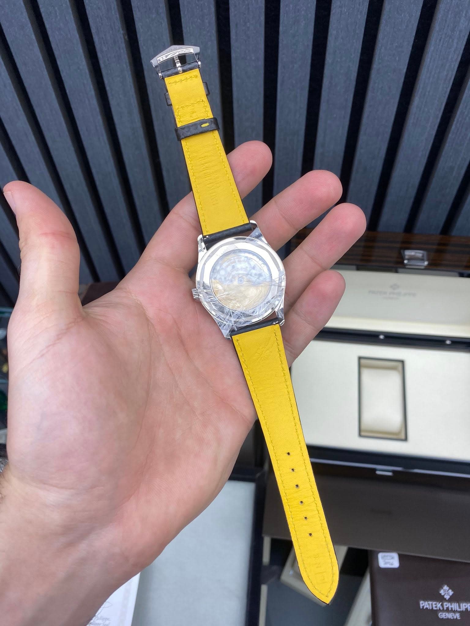 May be an image of wrist watch and text that says 'PATEKPHILIPI PATEK PHILIPE GENEVE'