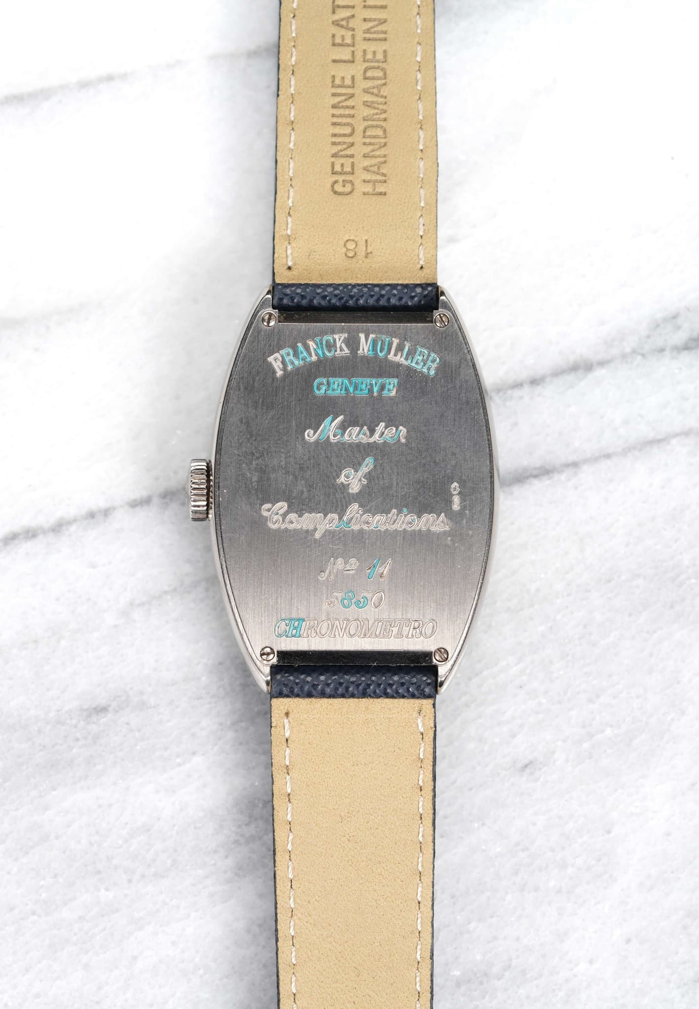 May be an image of wrist watch, leather and text that says 'רגו EAUIRA HANDMADEIN IN GENUINE 81 FRANCKMULLER FRANCK MULLER GENEVE Master WOHII . 心棉 ЛAИa အ CHRONOWETRO'