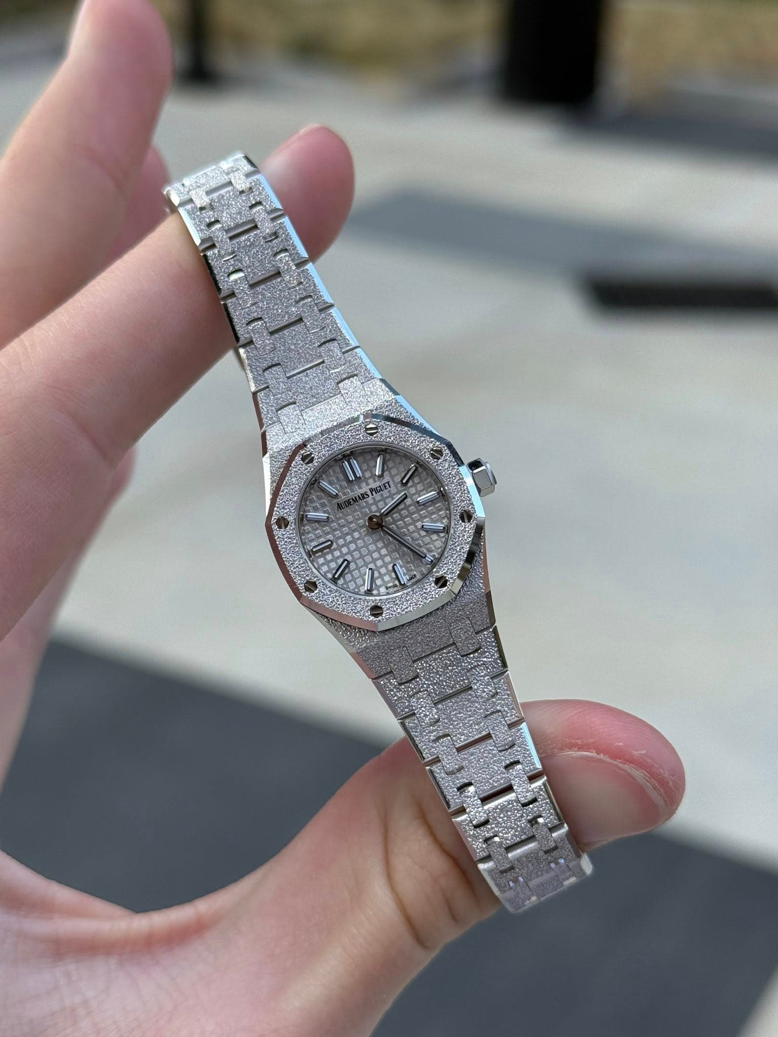 May be an image of wrist watch and text