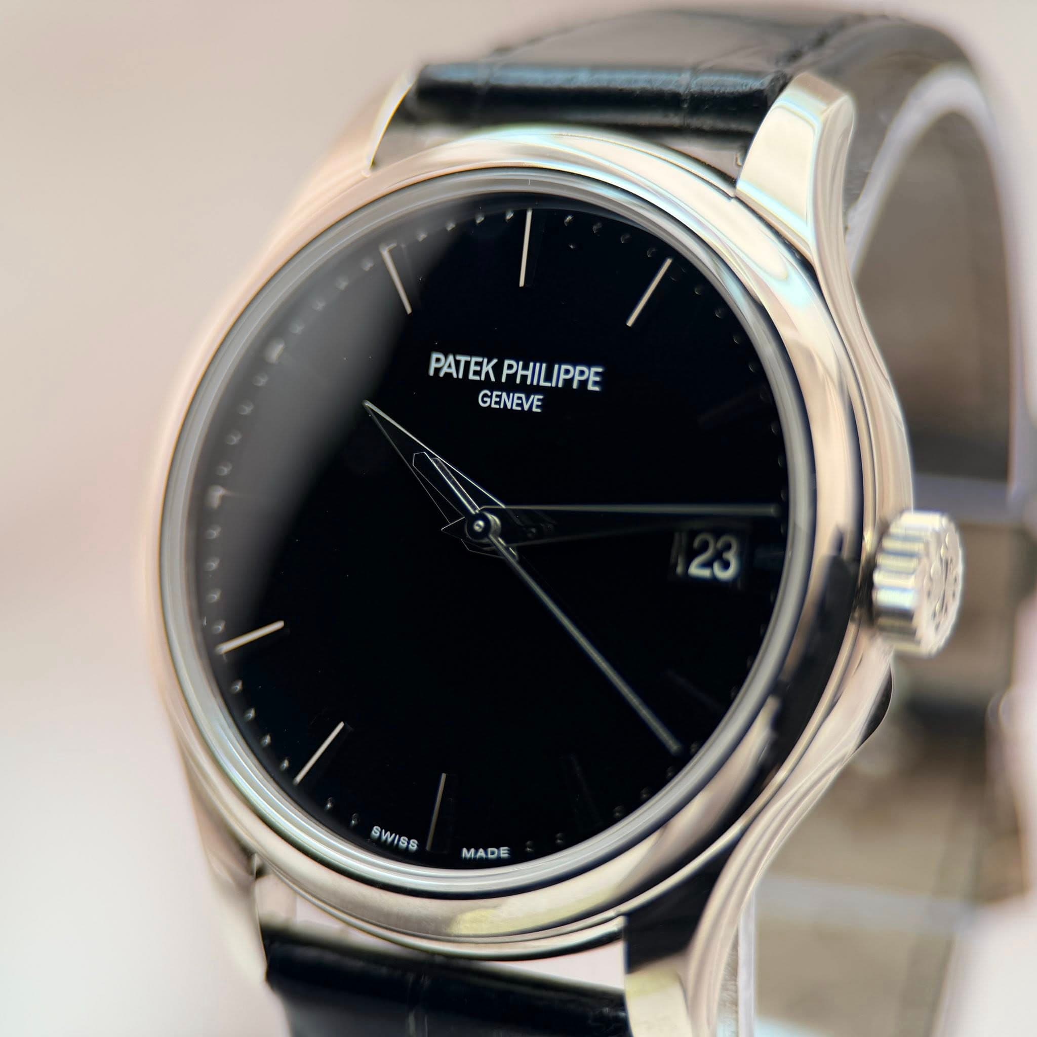 May be an image of digital watch and text that says 'I PATEK PATEKPHILIPPE PHILIPPE GENEVE 23 SW SWISS MADE MA'