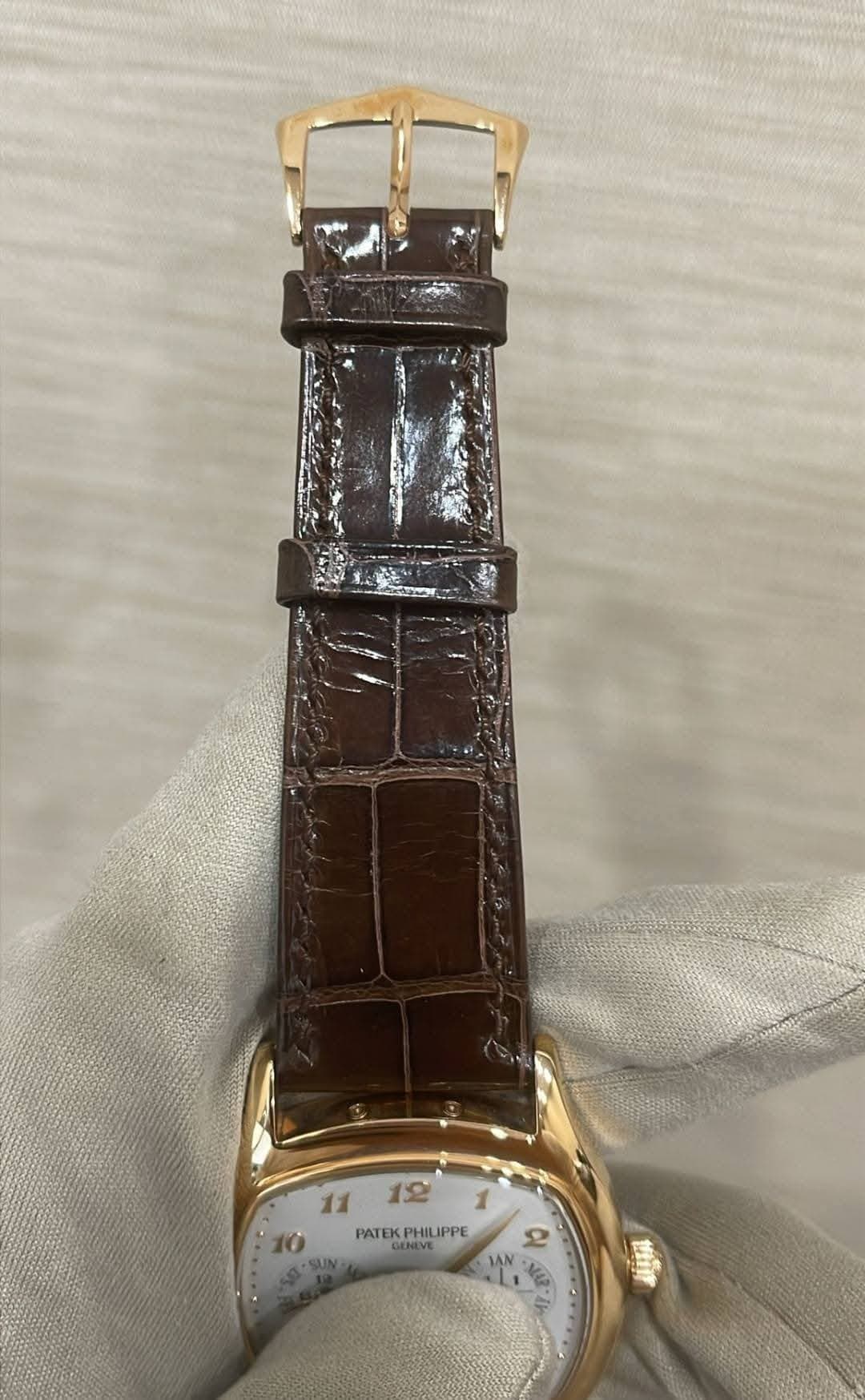 May be an image of wrist watch and text