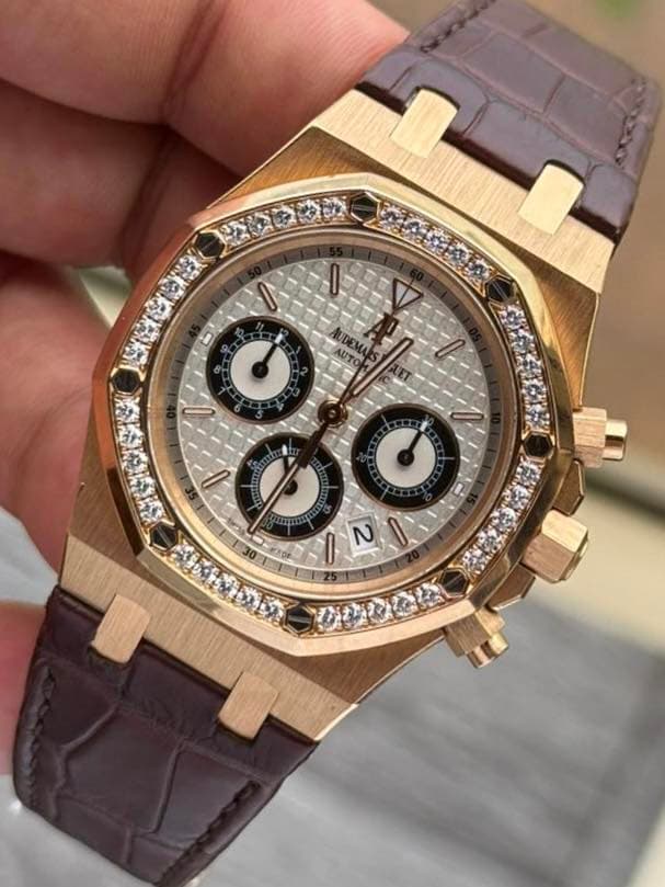 May be an image of wrist watch and text