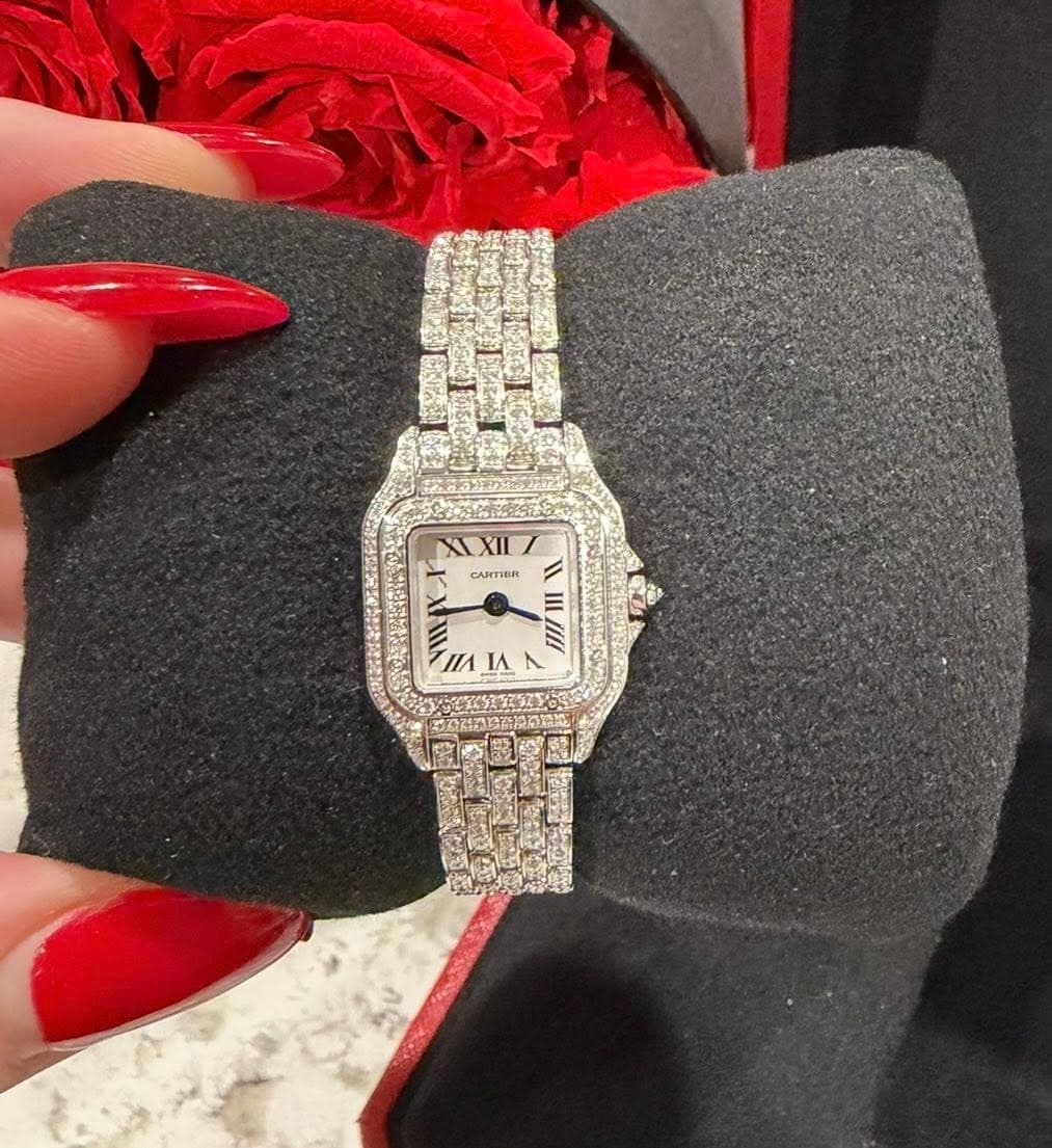 May be an image of wrist watch and text