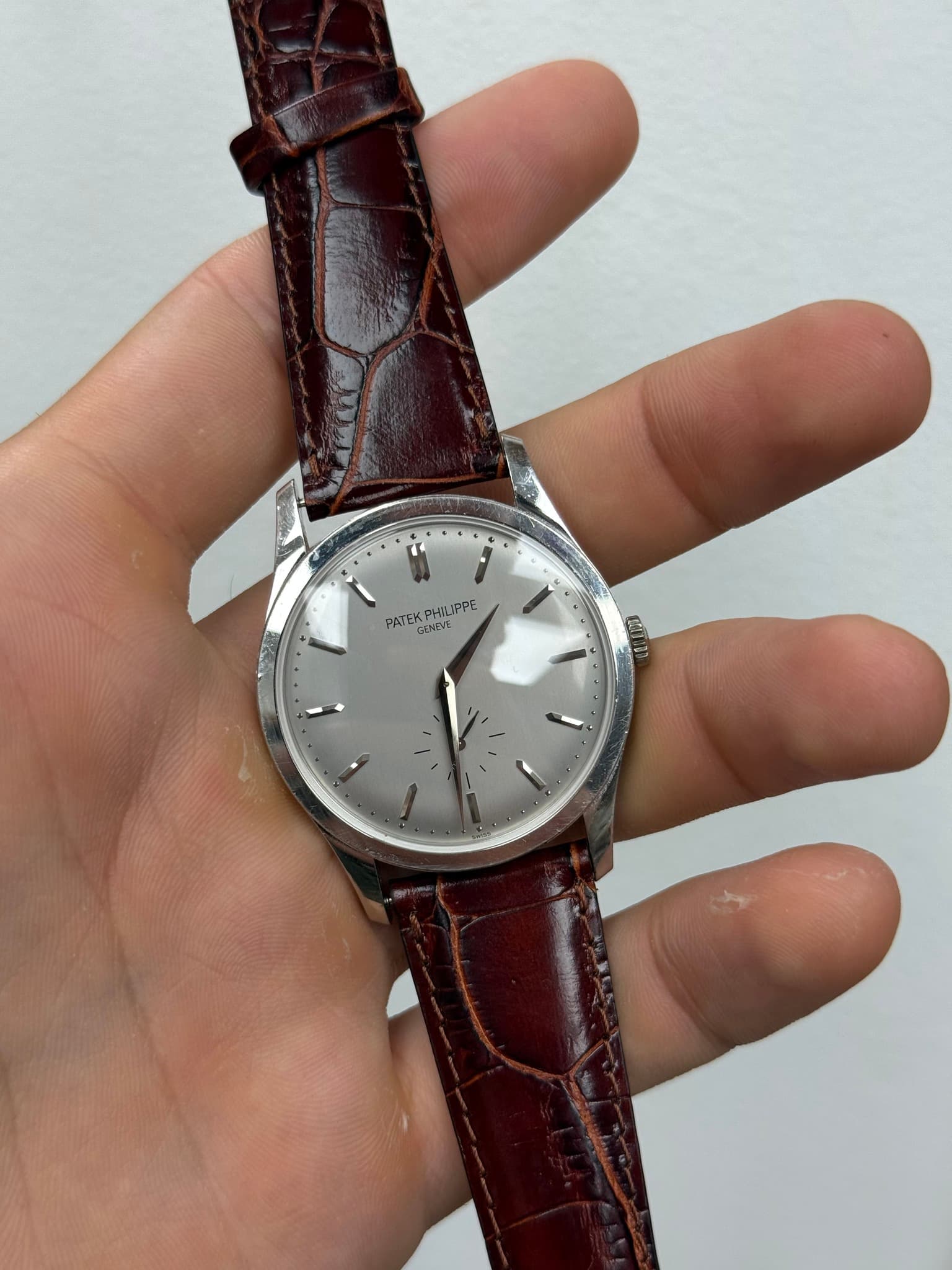 May be an image of wrist watch and text that says '* C f PATEK FK PHILIPPE GENEVI'
