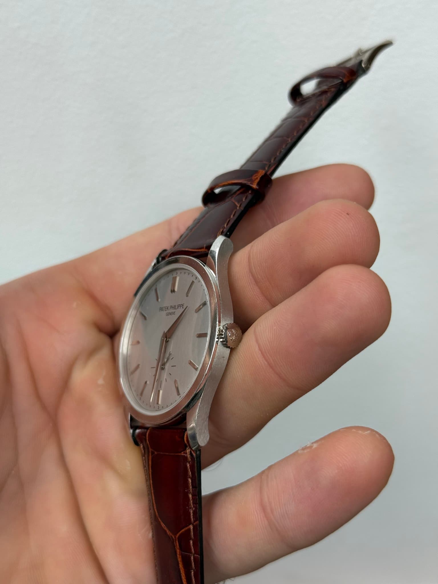 May be an image of wrist watch and leather