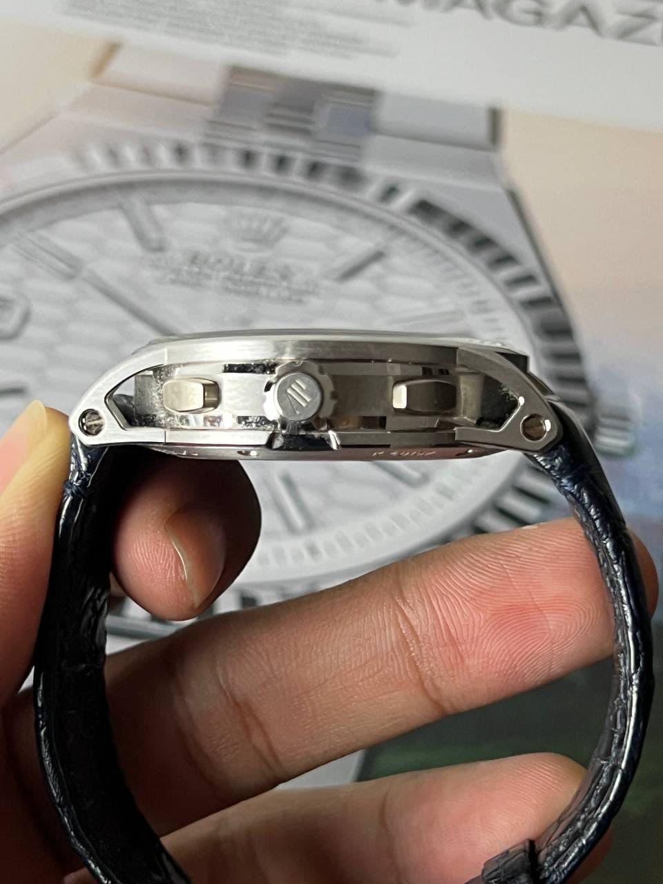 May be an image of wrist watch and text
