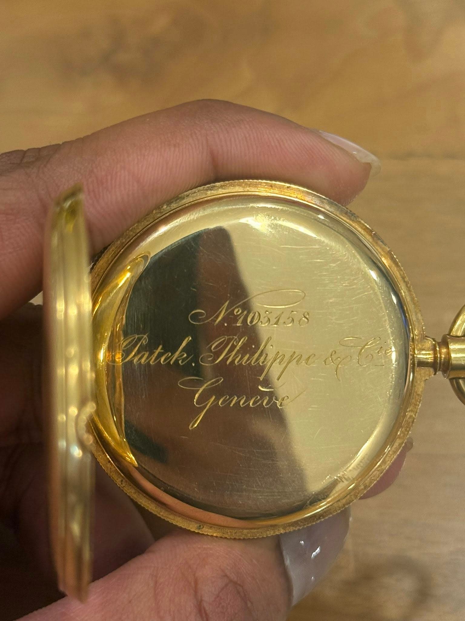 May be an image of wrist watch and text that says ' atek nиBppe Goner'