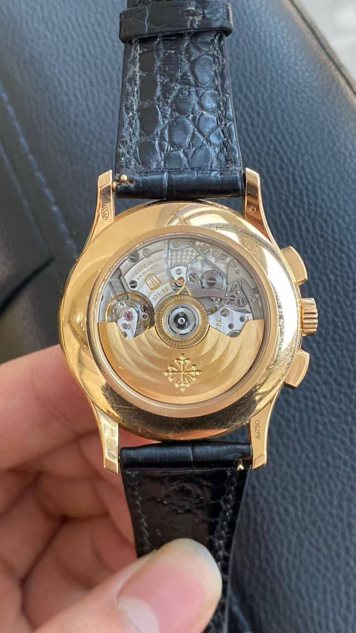 May be an image of wrist watch and text