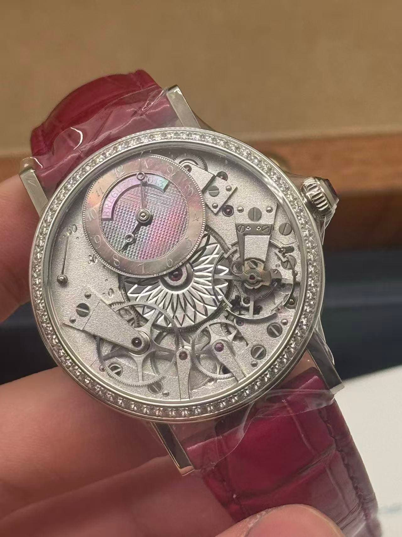 May be an image of wrist watch and text