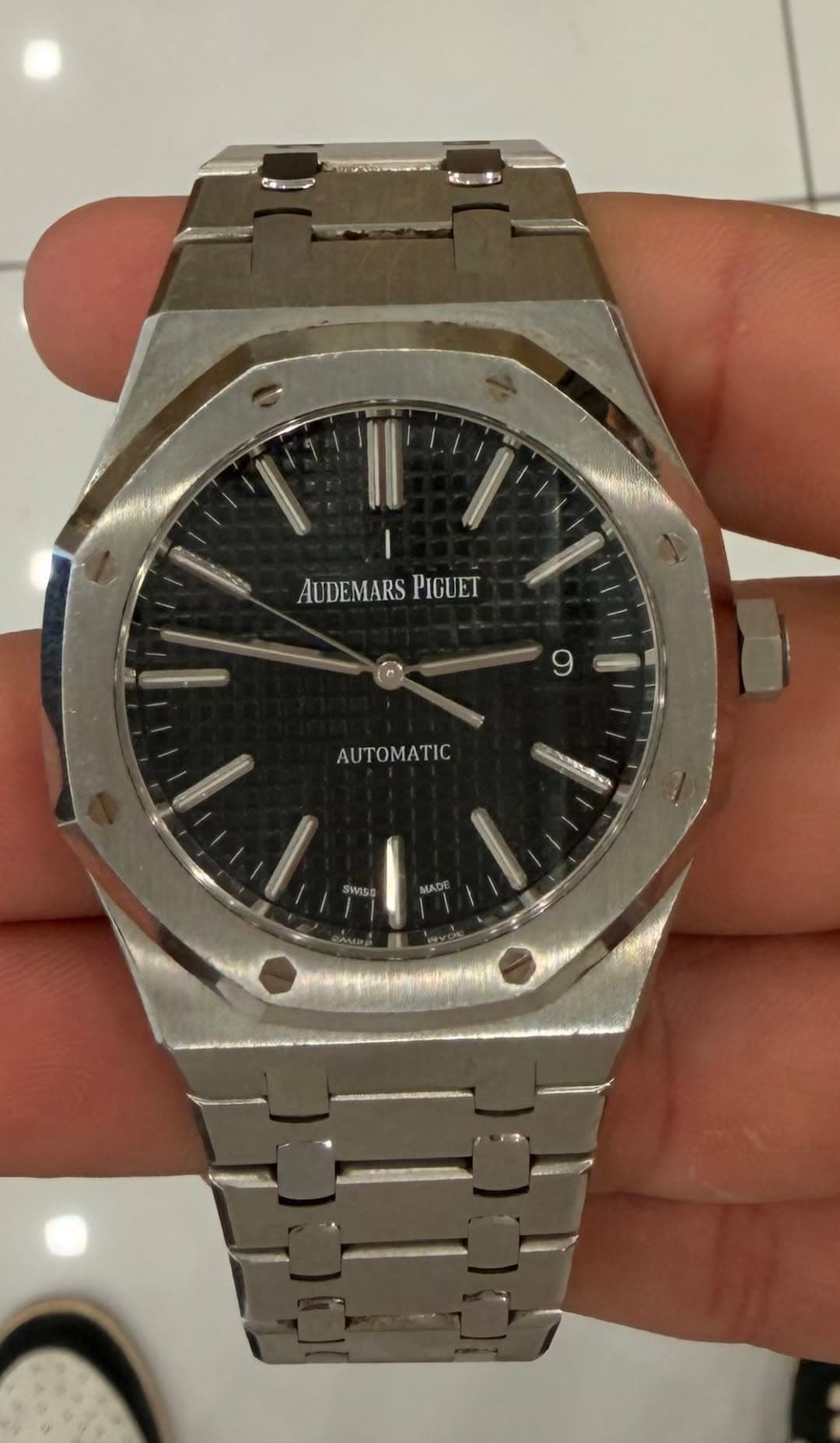 May be an image of wrist watch and text