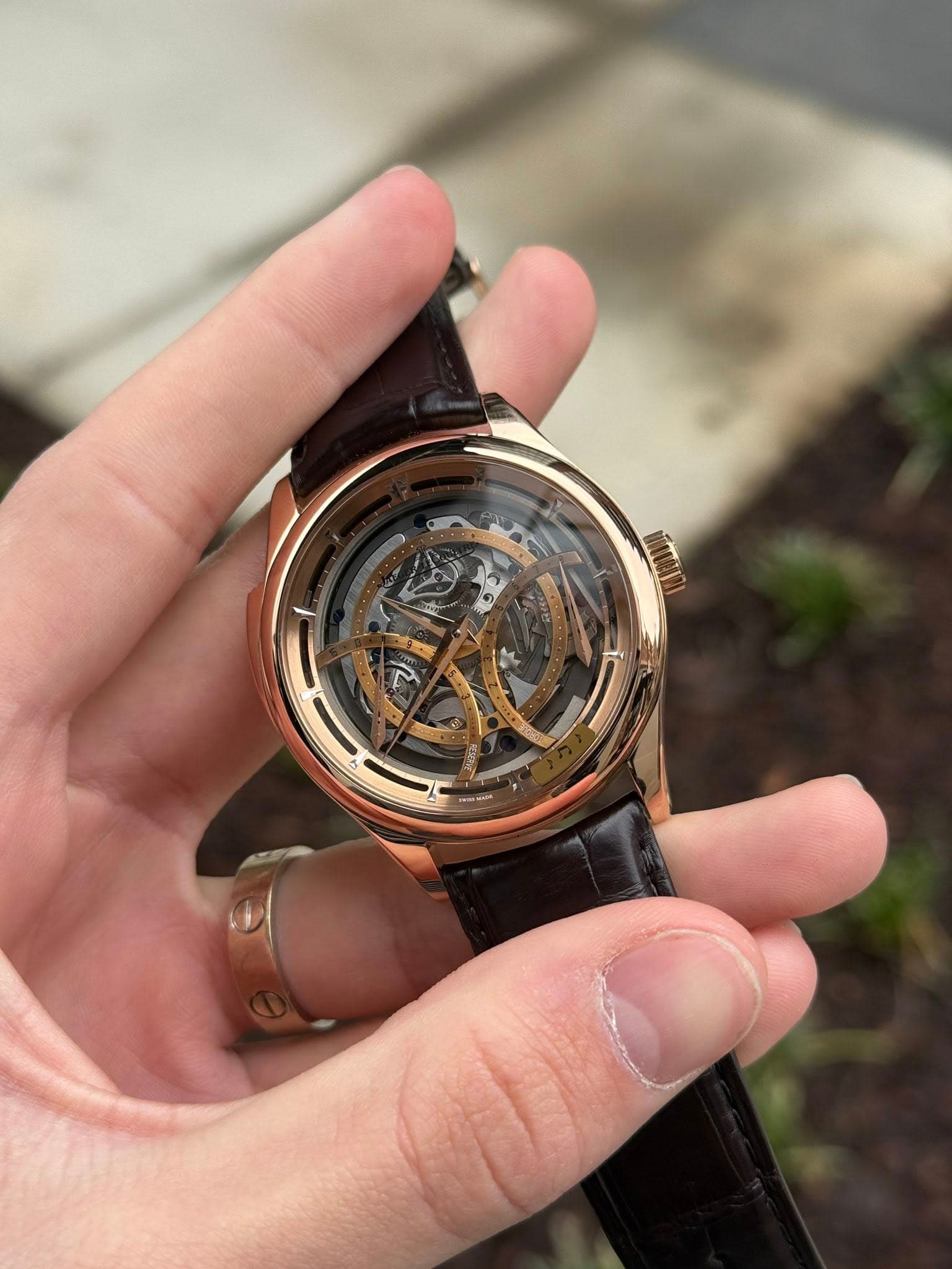 May be an image of wrist watch and text