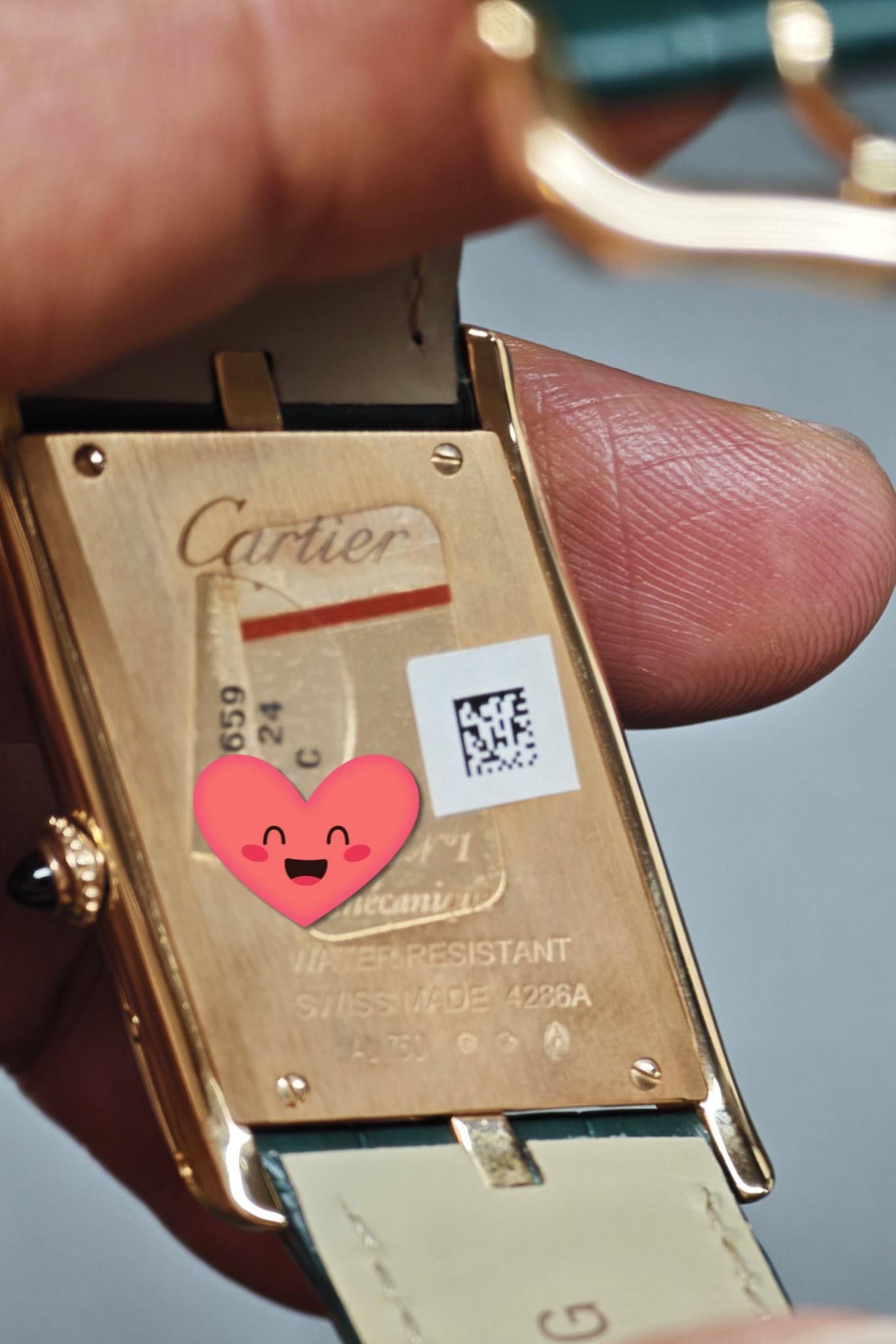 May be an image of wrist watch and text
