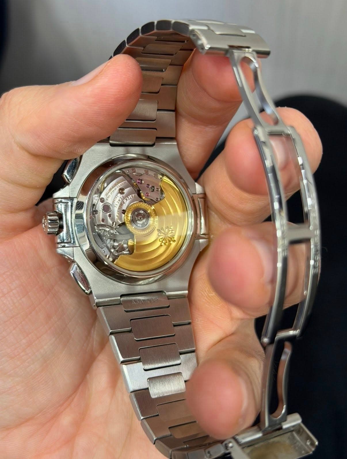 May be an image of wrist watch and text