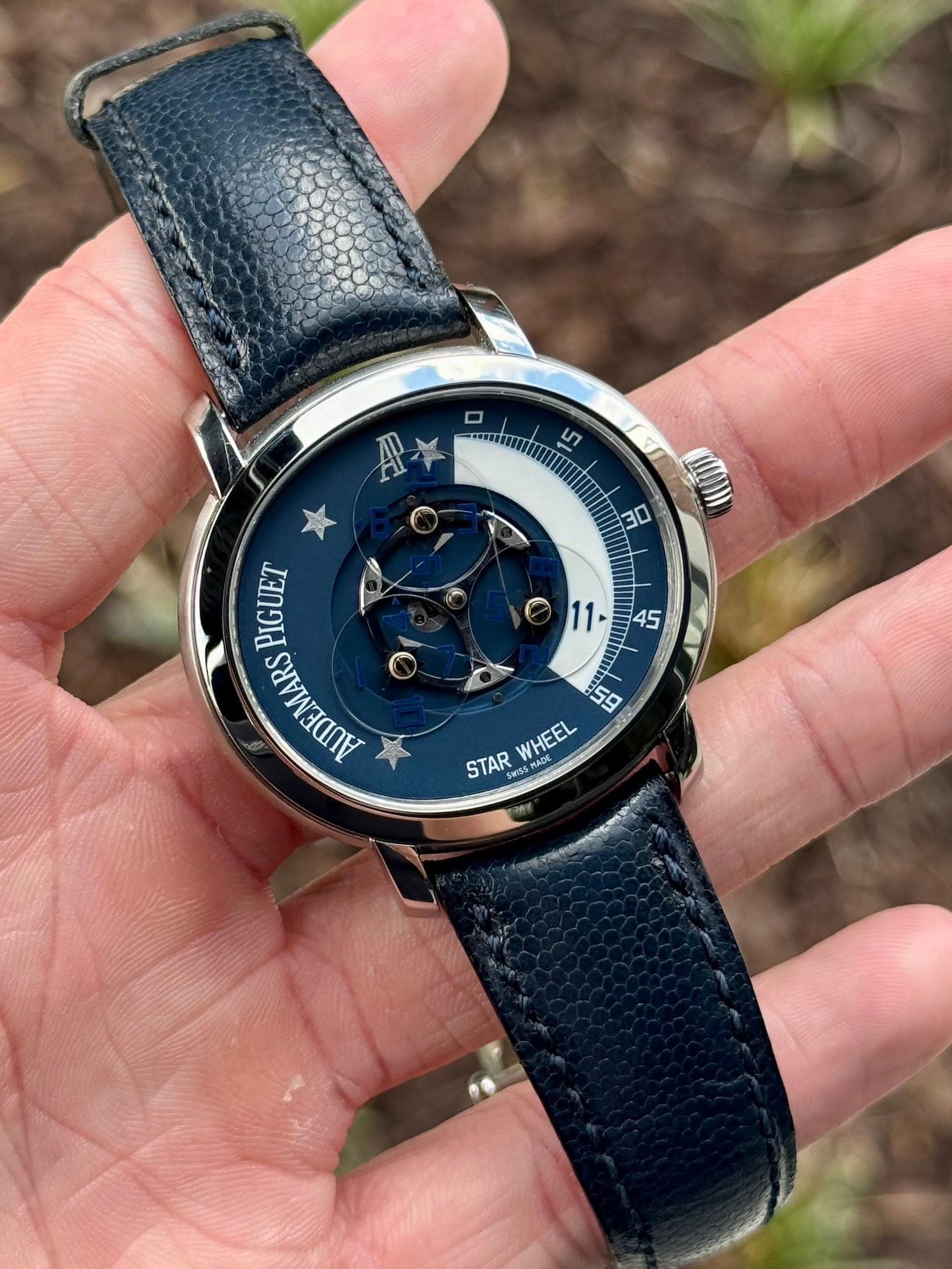 May be an image of wrist watch and text that says 'LT A* 30 11 45 PIGUET Di AUDEMARS 1จ WHEEL STAR Swiss SWISMADE SMA MAD'
