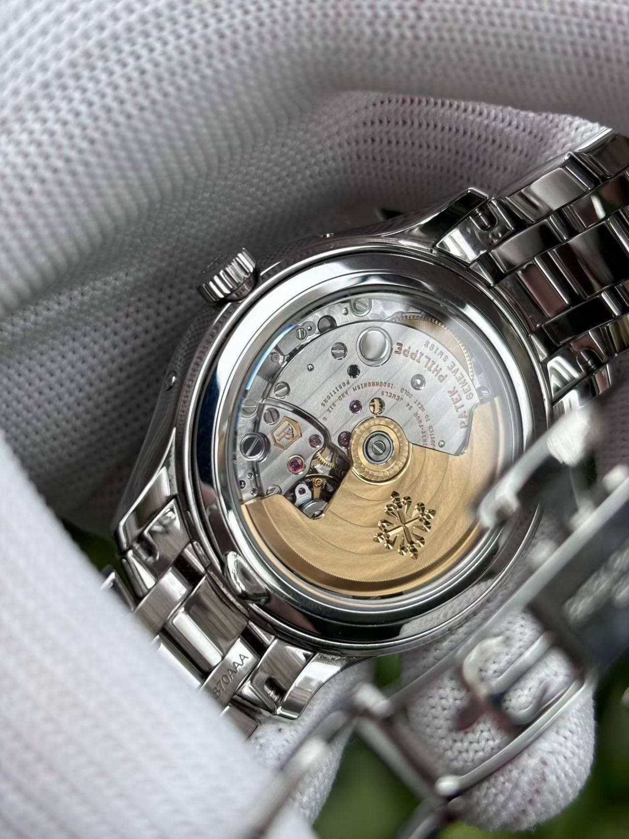 May be an image of wrist watch and text
