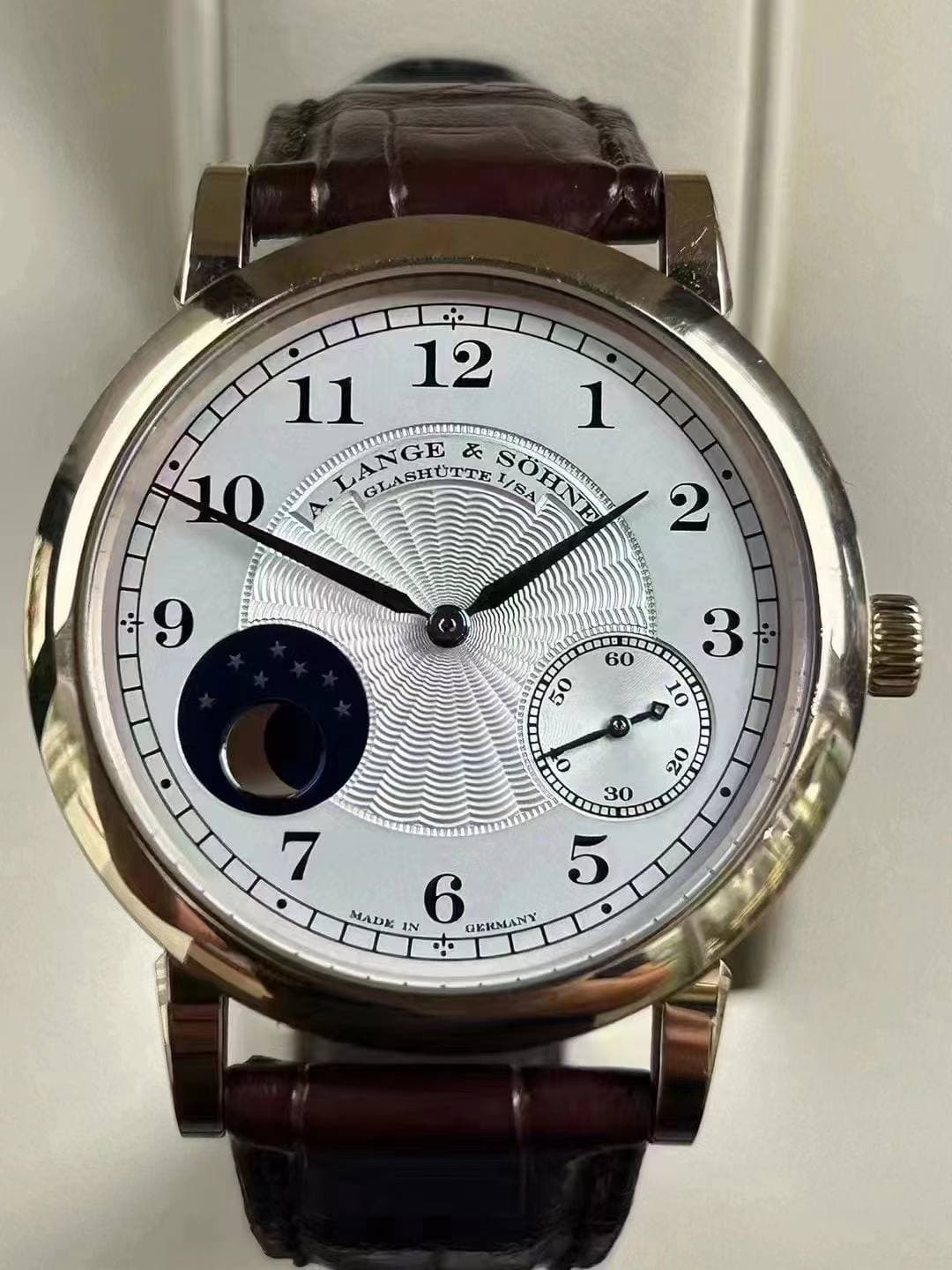 May be an image of wrist watch and text