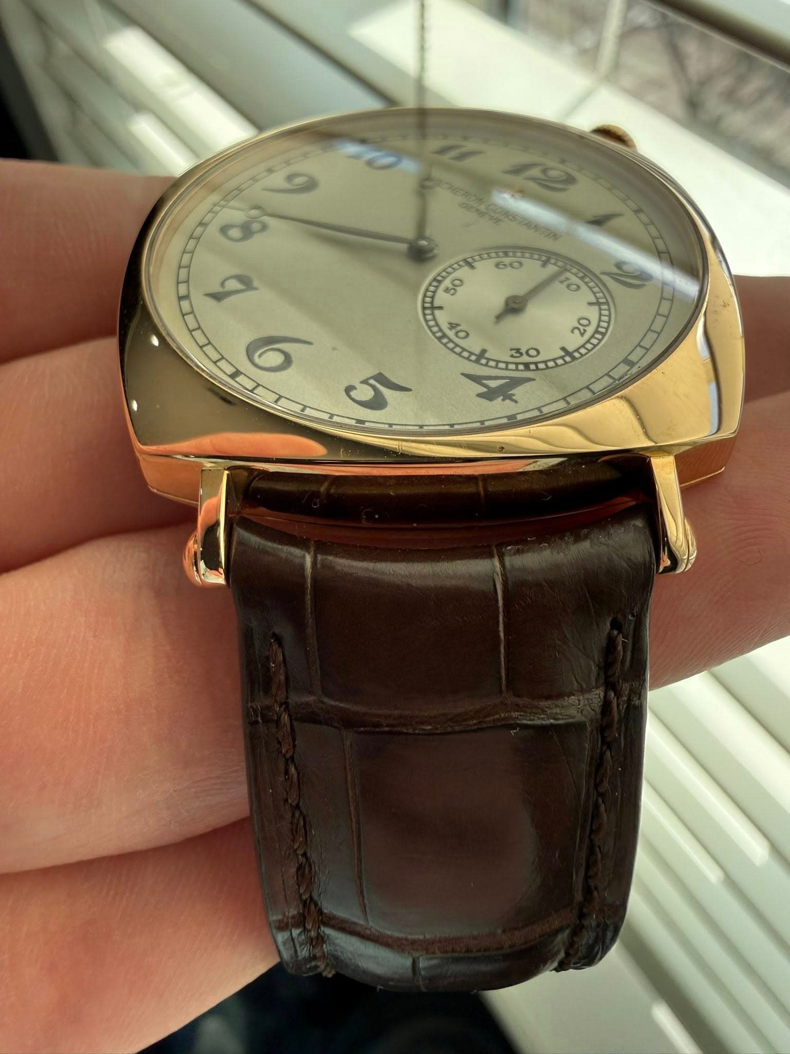 May be an image of wrist watch and text