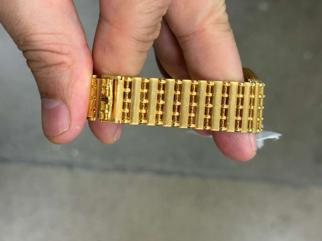 May be an image of jewelry and wrist watch