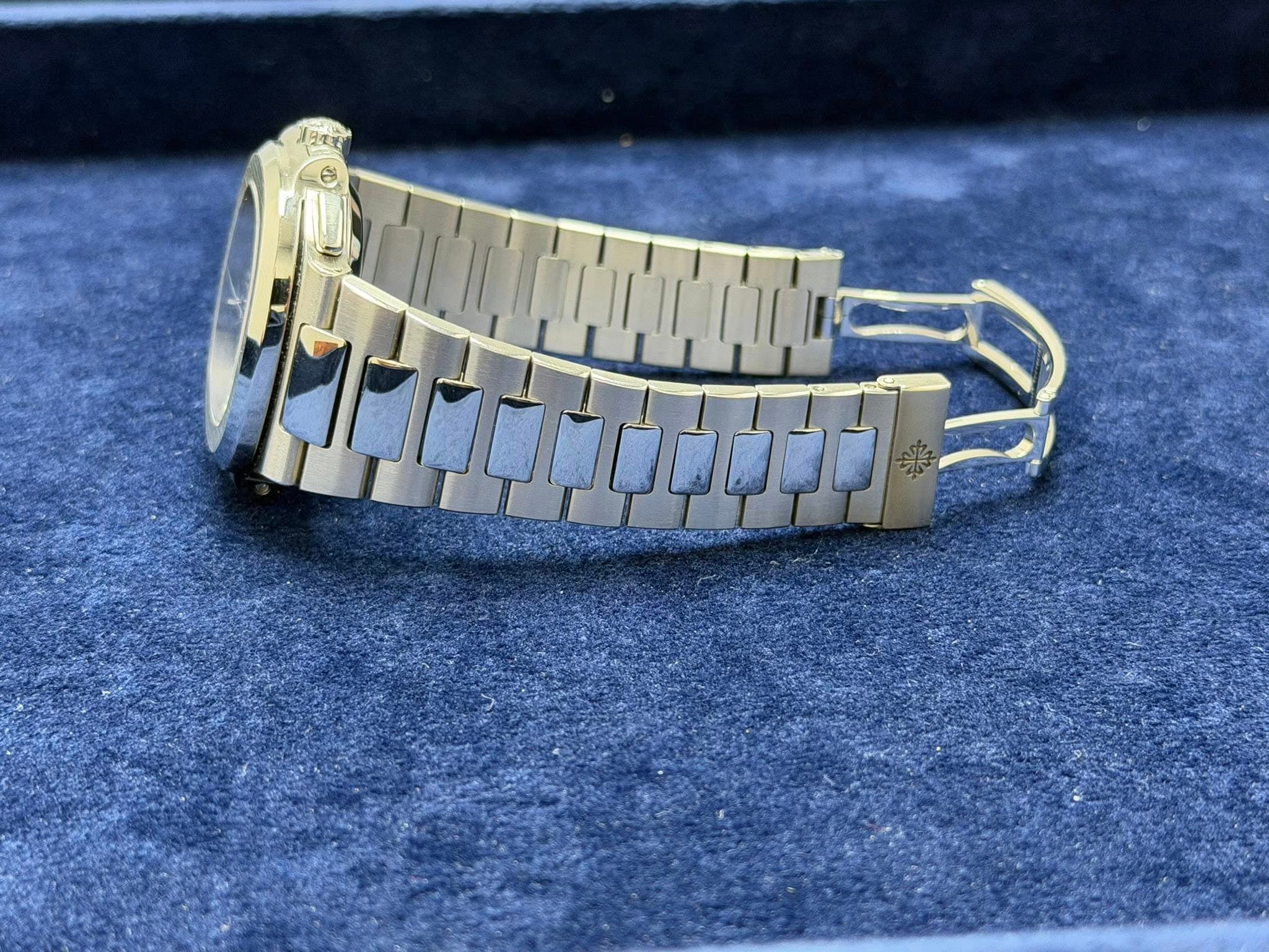 May be an image of wrist watch, jewelry and text