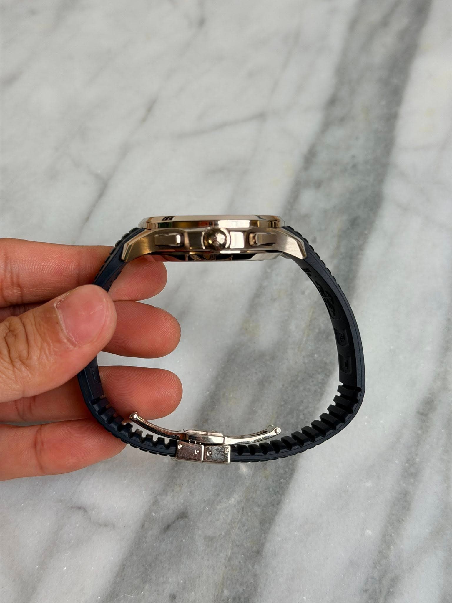 May be an image of digital watch and jewelry
