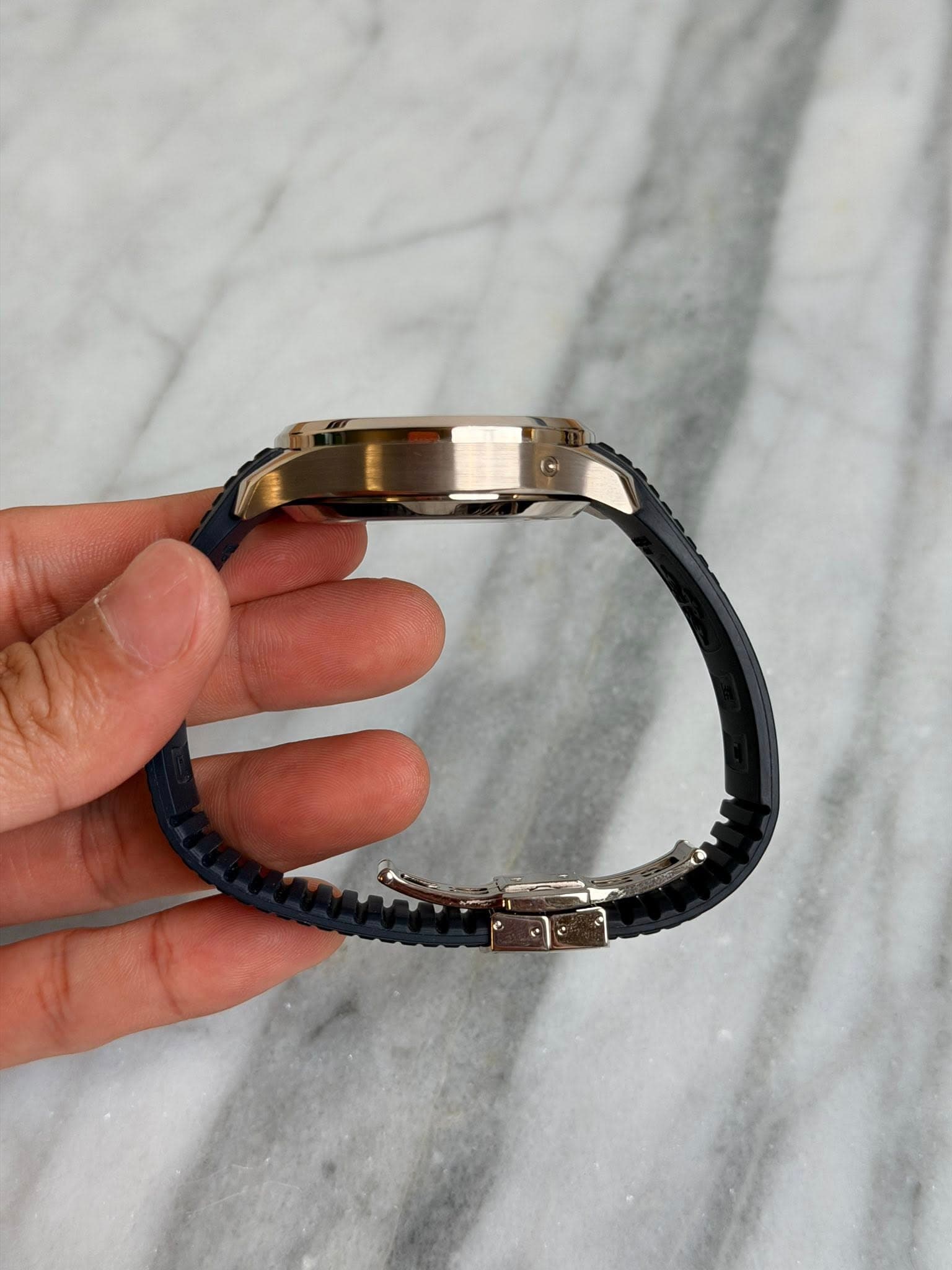 May be an image of wrist watch and jewelry