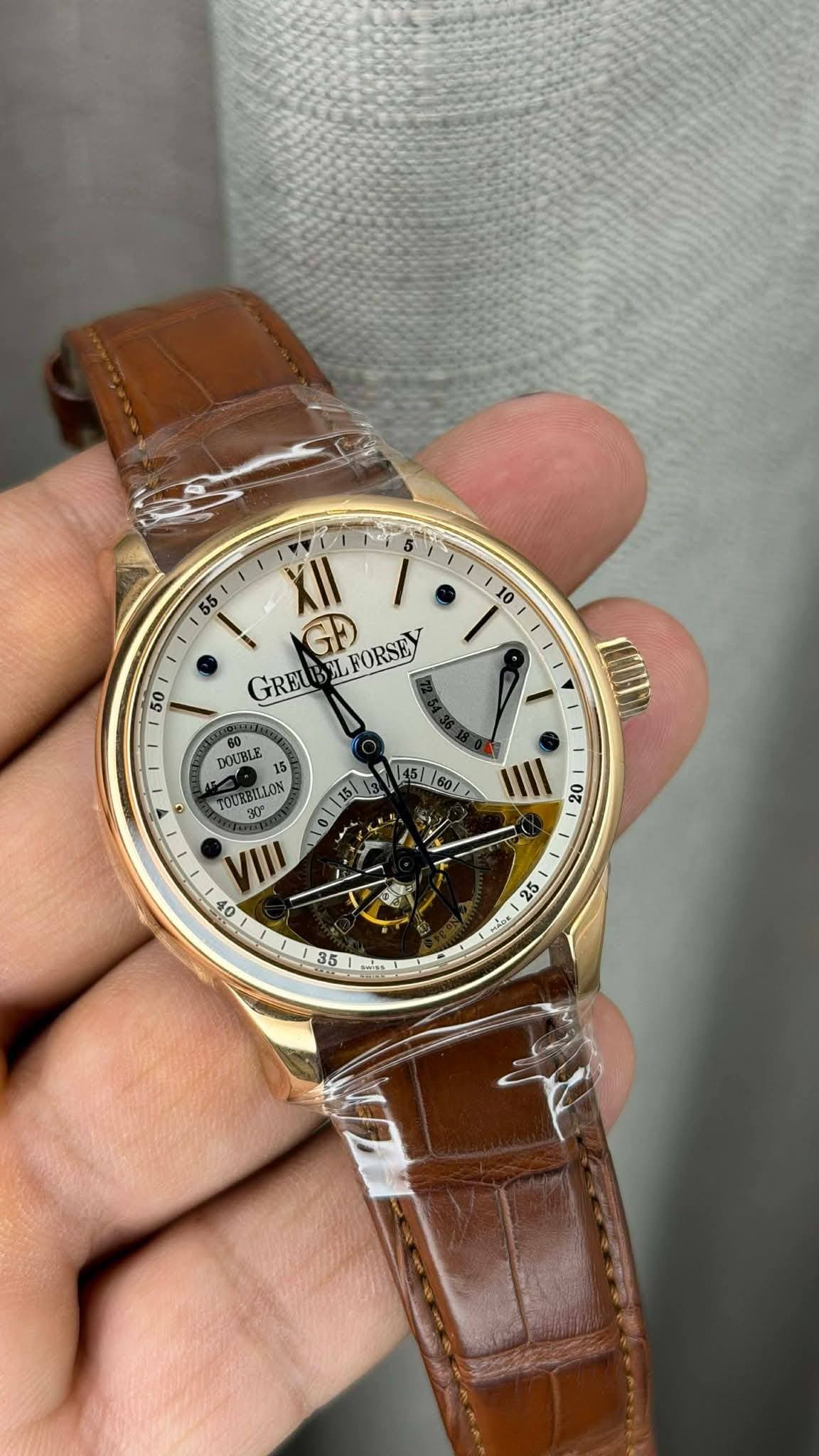 May be an image of wrist watch and text that says ' XII GRE GRELEELFORSE L GD FORSEY 50 I 60 DOUBLE 5 5 TOURBILLON 145160/ IIII 20 O8 OE 5 ហ 35 Mt'