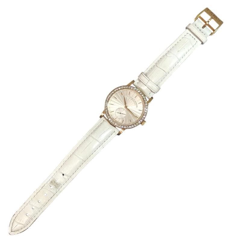 May be an image of leather and wrist watch