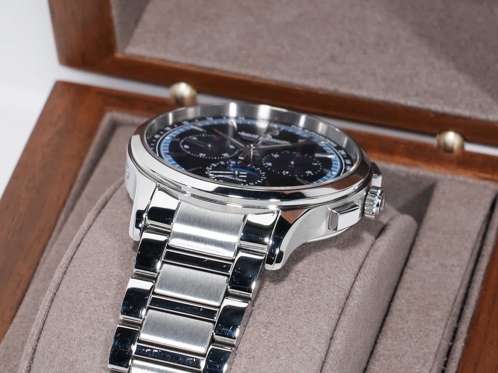 May be an image of wrist watch and text