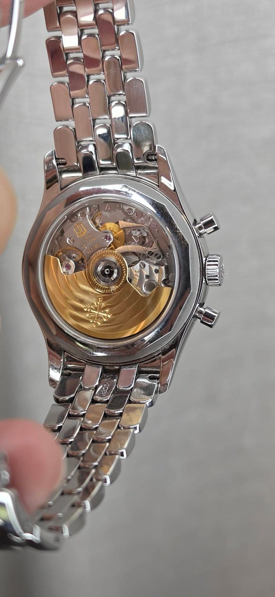 May be an image of wrist watch and text