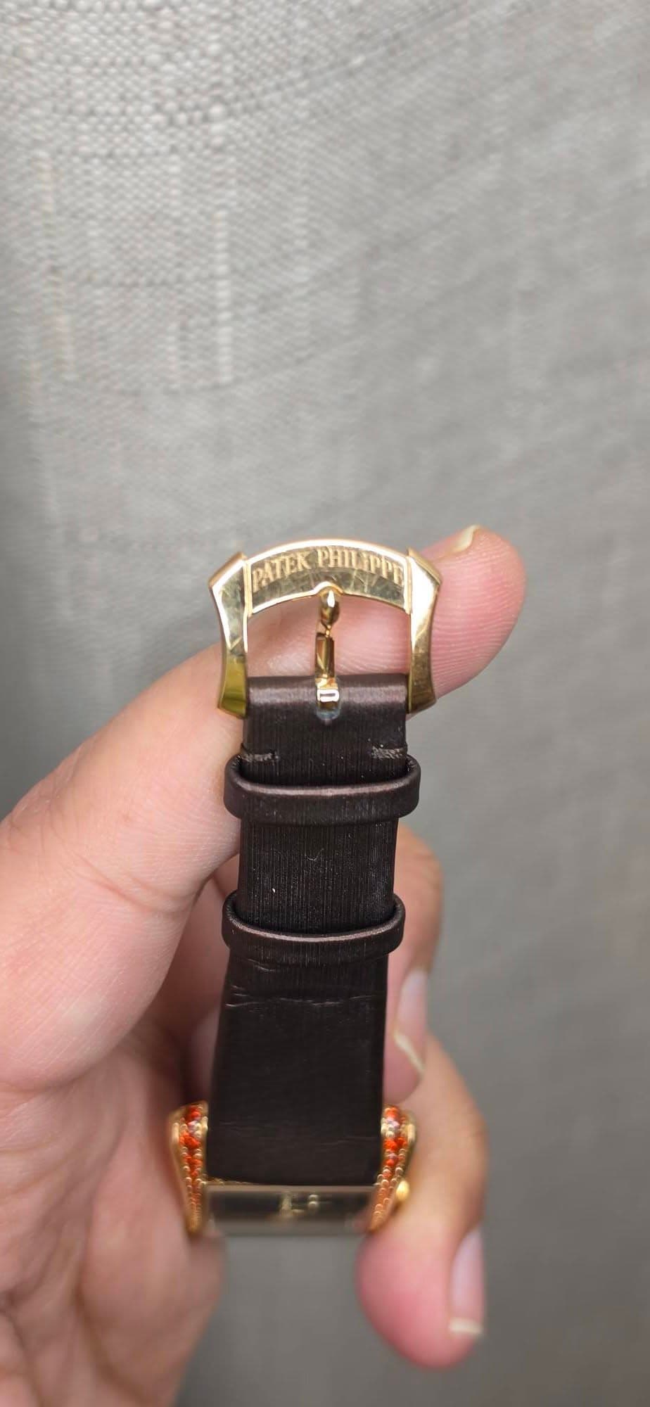 May be an image of wrist watch and text