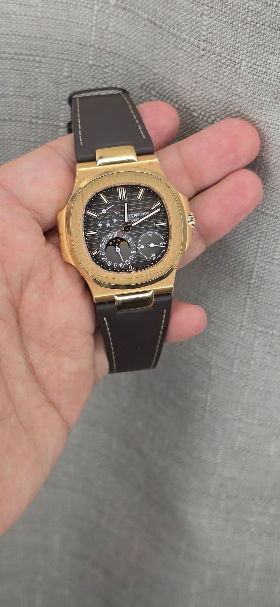 May be an image of wrist watch and text