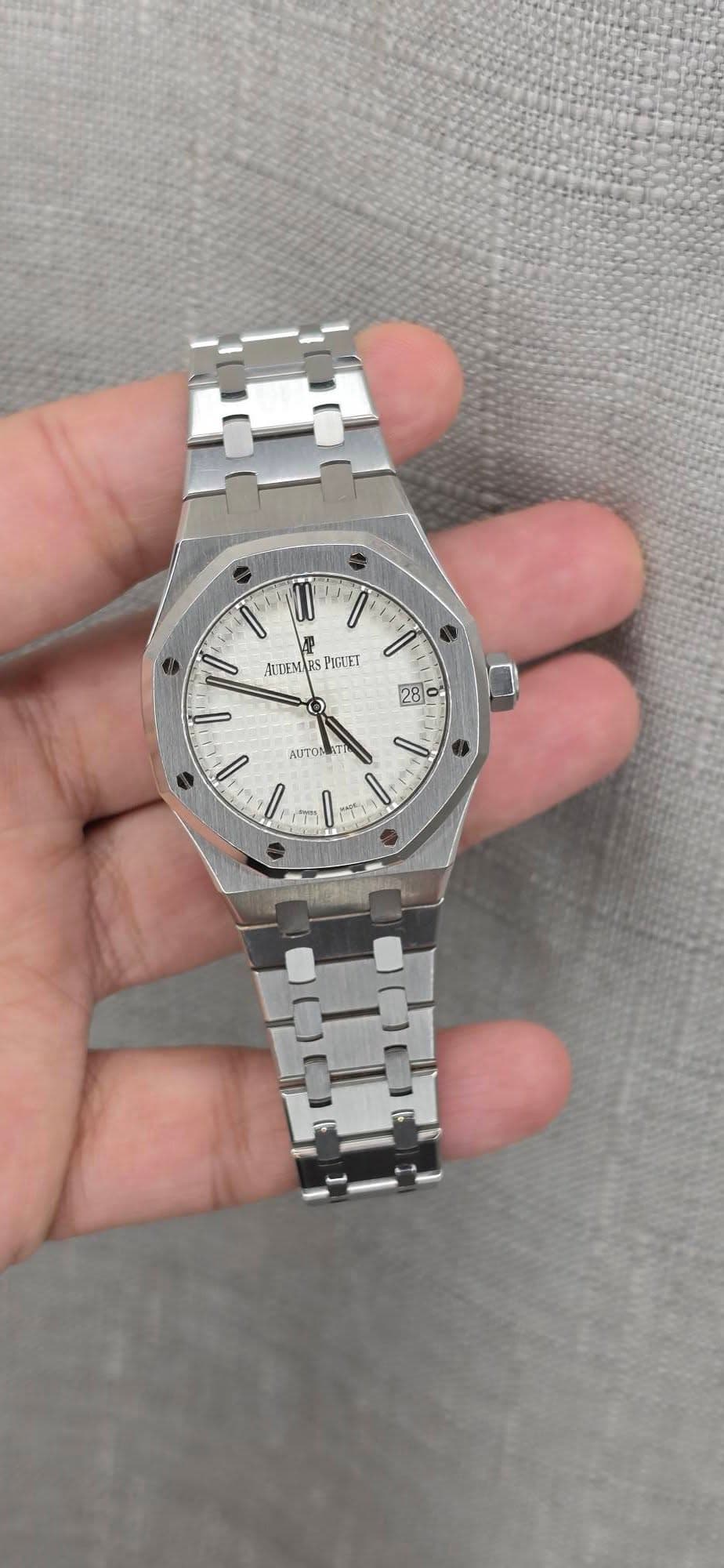 May be an image of wrist watch and text