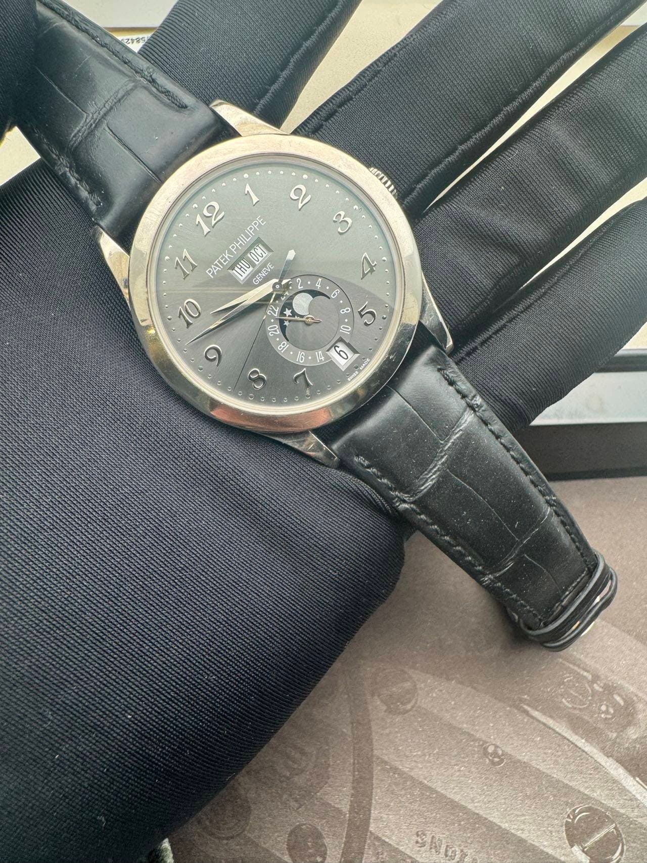 May be an image of wrist watch and leather